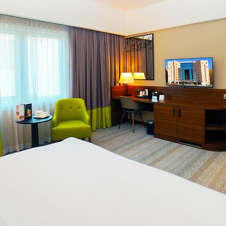 The Grand Lux Hotel Doha Exterior photo A room at the hotel