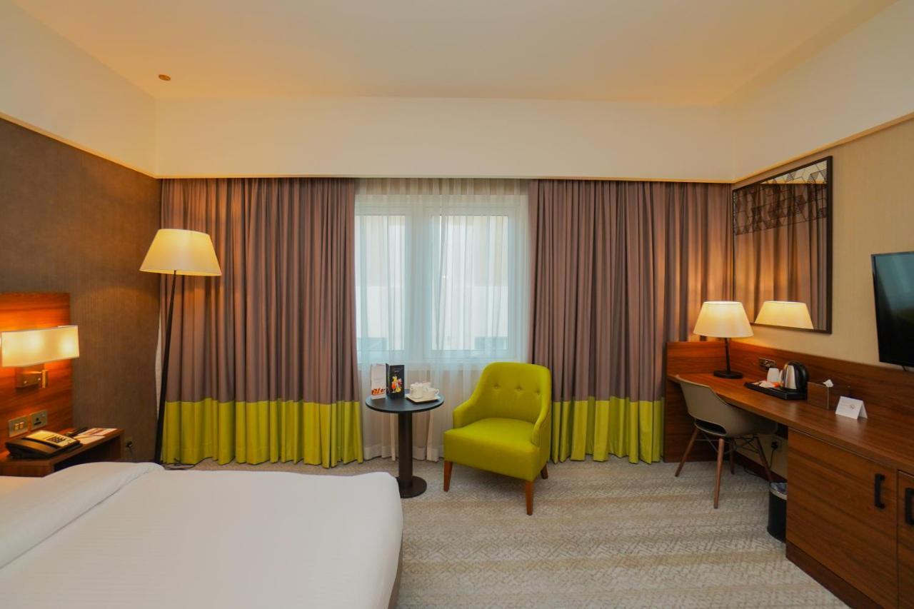 The Grand Lux Hotel Doha Exterior photo A room at the hotel