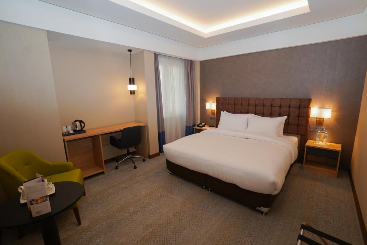 The Grand Lux Hotel Doha Exterior photo A room at the hotel