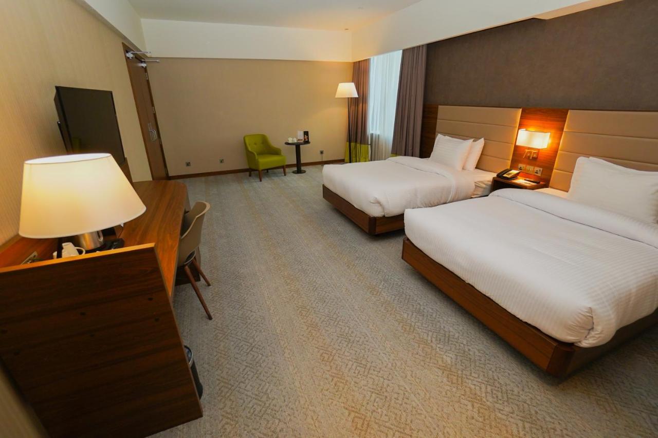 The Grand Lux Hotel Doha Exterior photo A room at the hotel