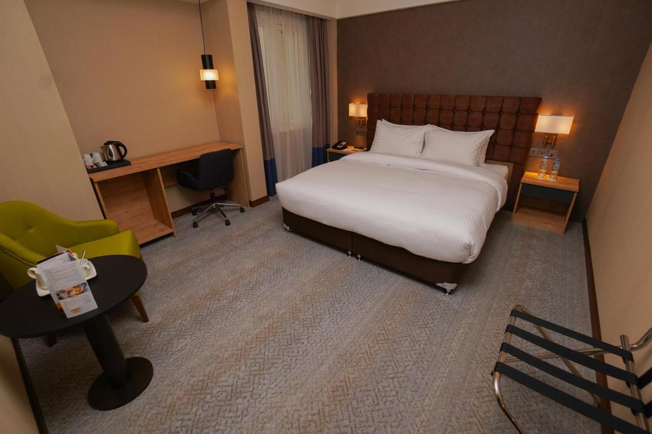 The Grand Lux Hotel Doha Exterior photo A room at the hotel