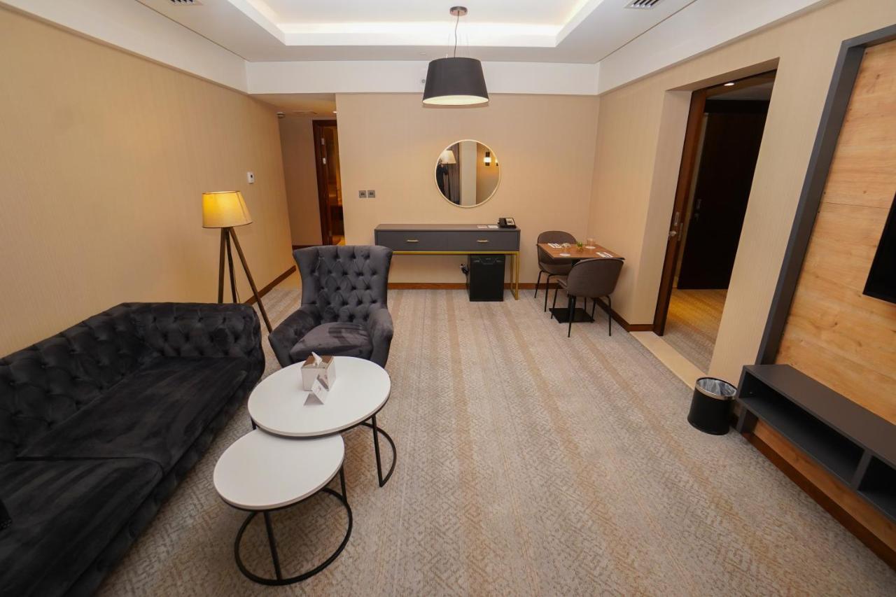 The Grand Lux Hotel Doha Exterior photo A suite at the hotel