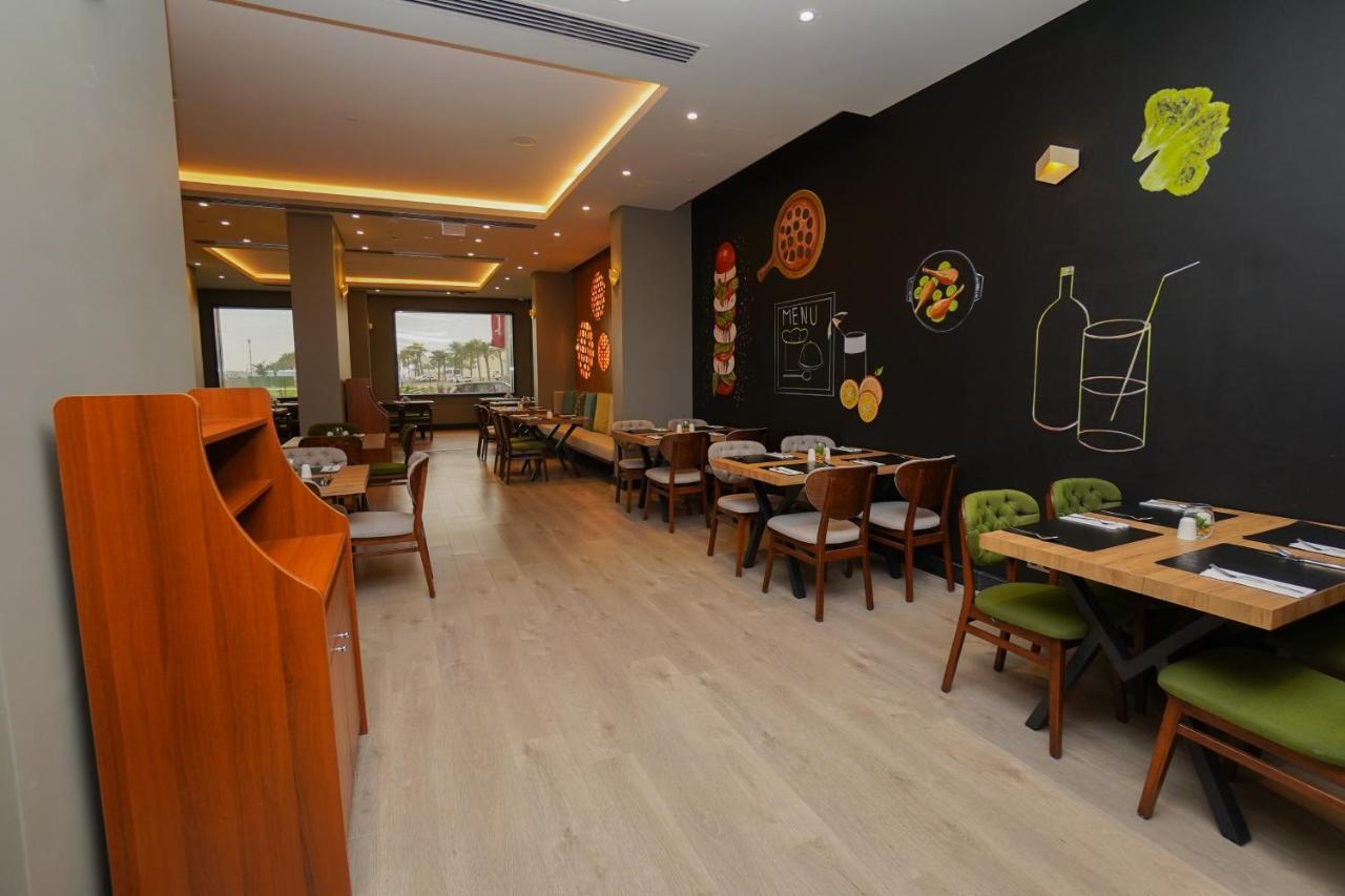 The Grand Lux Hotel Doha Exterior photo Interior of a restaurant in Cairo, Egypt