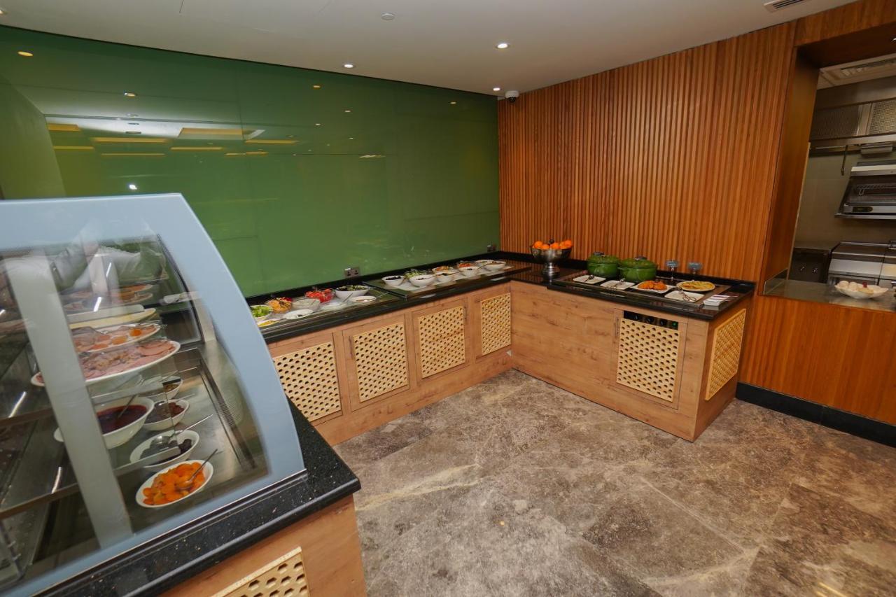 The Grand Lux Hotel Doha Exterior photo A salad bar at a hotel