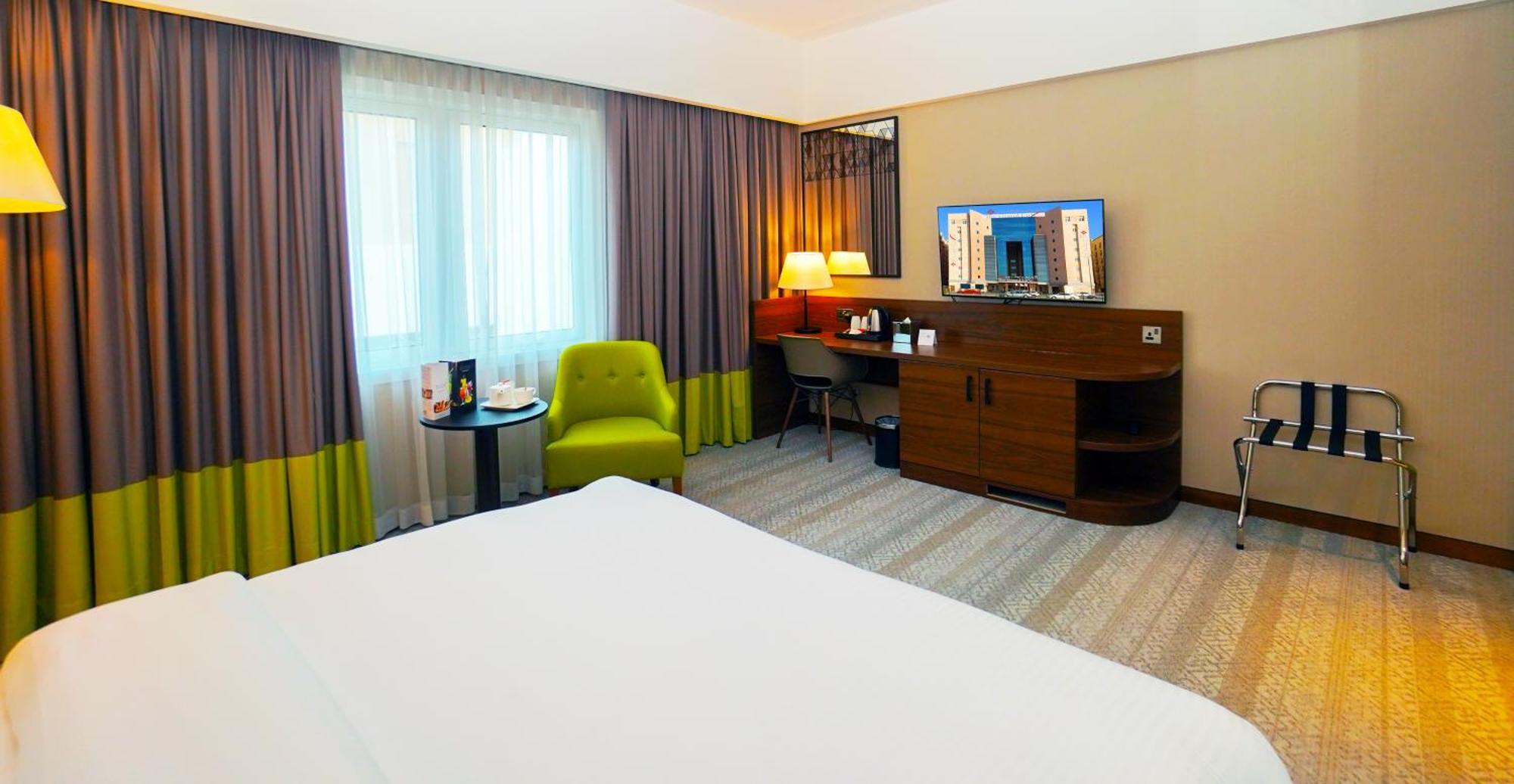 The Grand Lux Hotel Doha Exterior photo A room at the hotel